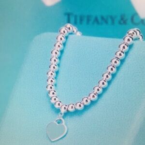 Tiffany & Co Silver Heart Necklace with Blue Charm